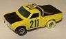 AFX Datsun pickup truck in yellow with blue number 211